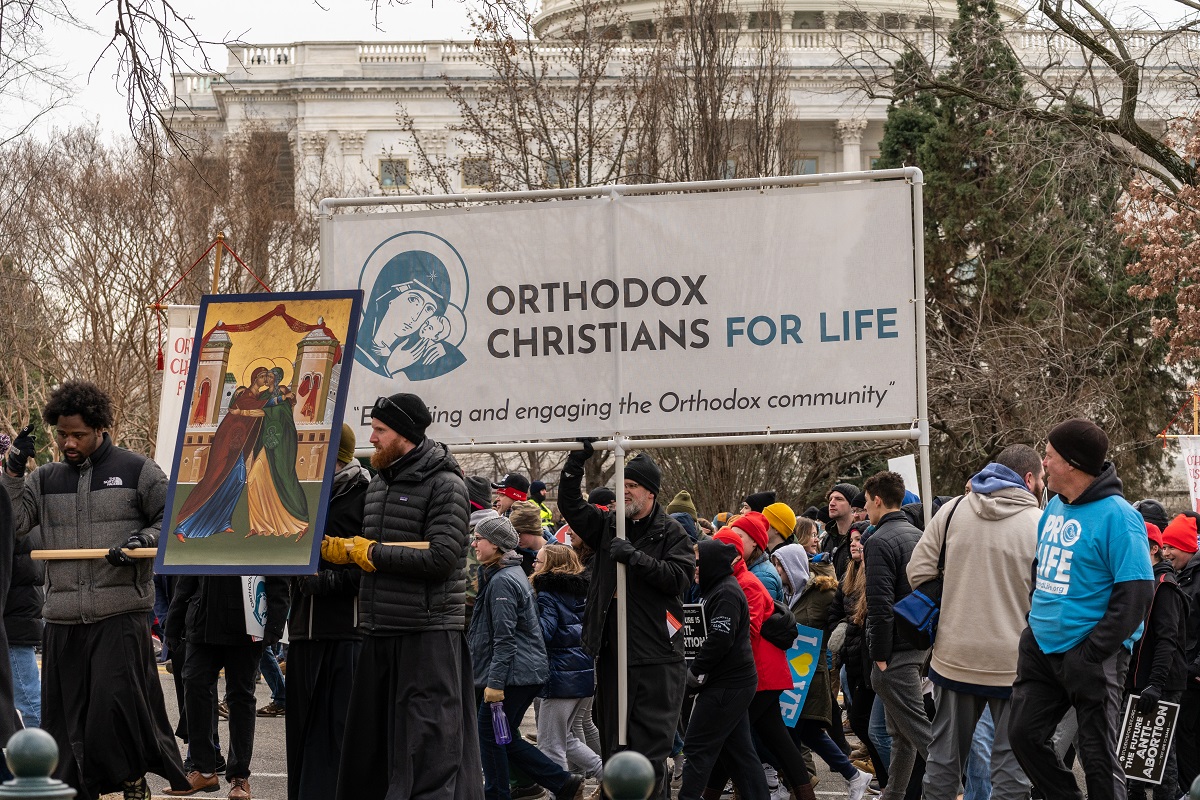 Crowd marches with Orthodox Christians for Life banner