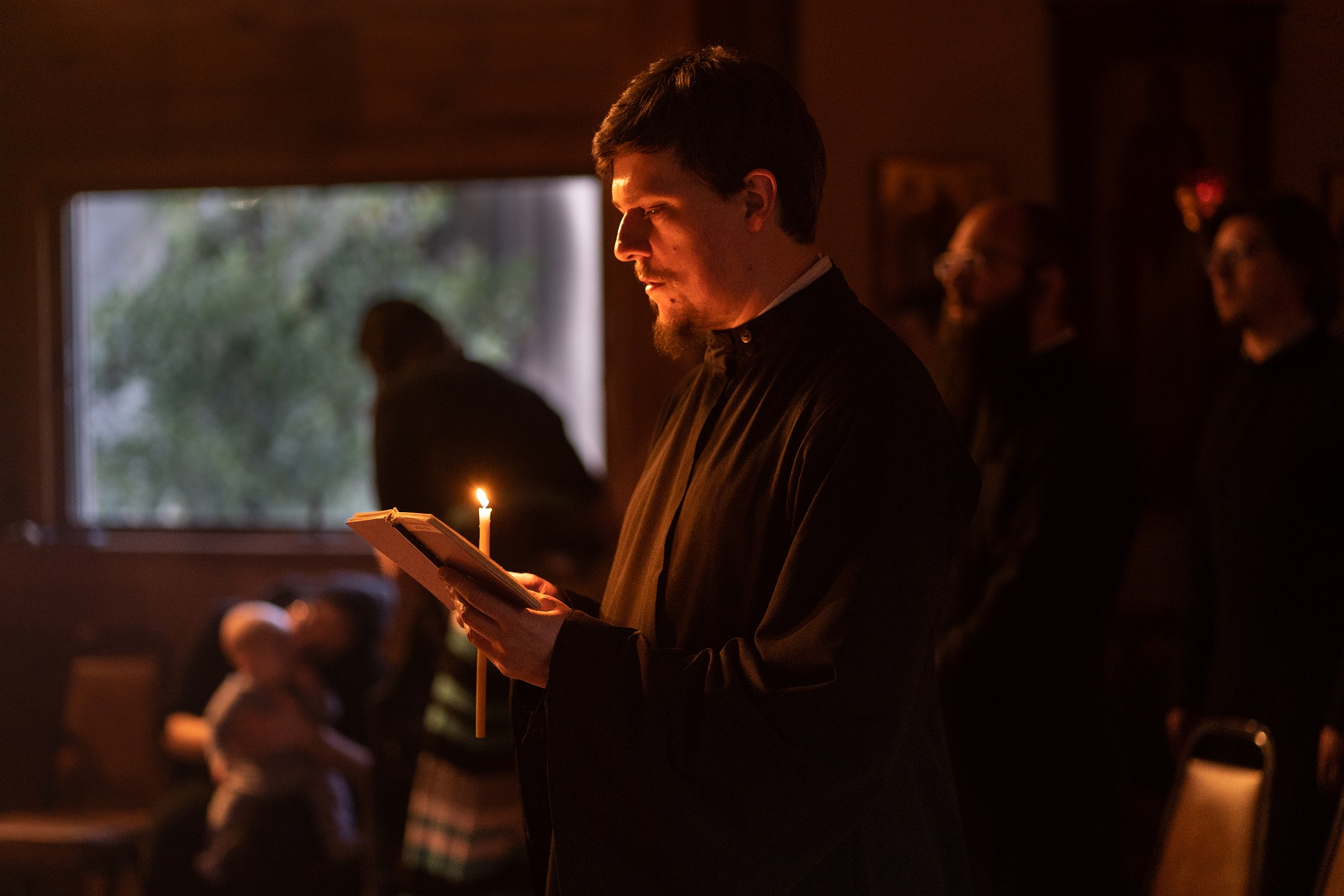 Dn Vitaly Permiakov reads during Bridegroom Matins