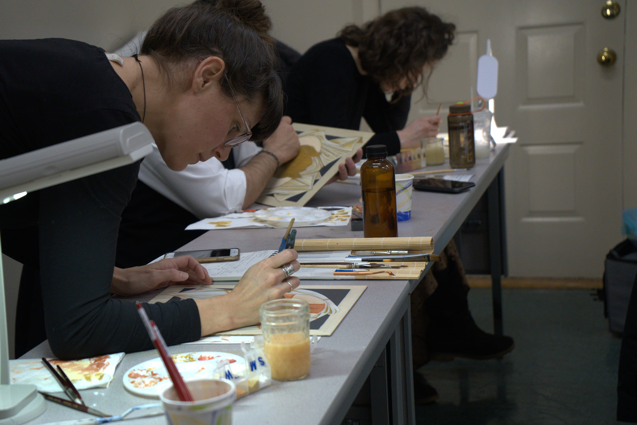 student works on her icon