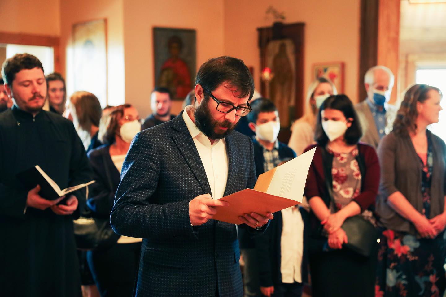Dr Alex Tudorie reads during Paschal liturgy