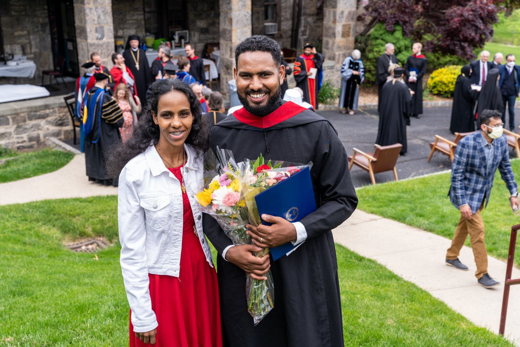 Graduate with his wife at the reception