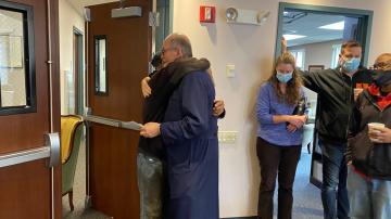 Fr Chad hugs Ramon at his farewell party