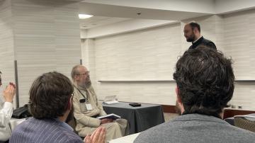 Fr Bogdan Bucur speaks at the special session honoring Archbishop Alexander