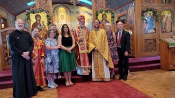 Fr Aaron Rutz and Matushka Tatiana with clergy and family following ordination