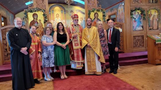 Fr Aaron Rutz and Matushka Tatiana with clergy and family following ordination