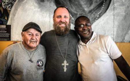 Fr. Justin with community members at Reconciliation Services (Photo taken pre-pandemic)  