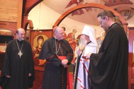 Presenting the pectoral cross: The Very Rev. Dr. Chad Hatfield, chancellor/CEO, St. Vladimir's; His Eminence Timothy Cardinal Dolan; His Beatitude Metropolitan Tikhon; and The Very Rev. Dr. John Behr, dean, St. Vladimir's. (photo: Roman Ostash)