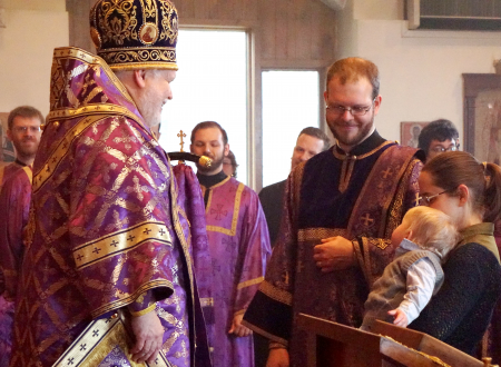 bishop and newly ordained priest with family