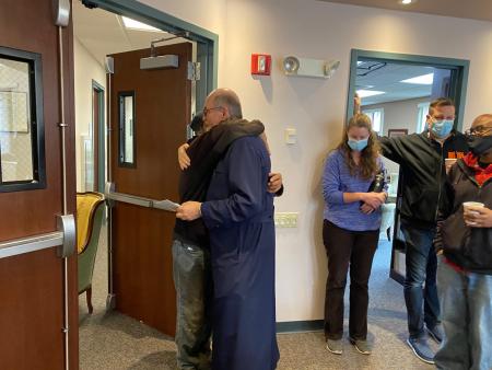 Fr Chad hugs Ramon at his farewell party