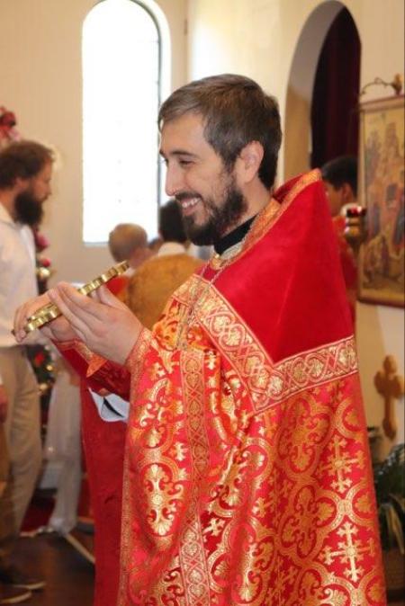 Fr Silouan blesses parishioners following Divine Liturgy