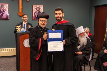 Subdeacon Daniel Hanna receives his diploma from Archbishop Dionysius John (Syriac Orthodox Church)