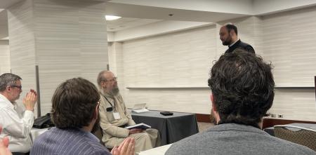 Fr Bogdan Bucur speaks at the special session honoring Archbishop Alexander