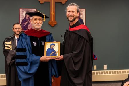 Fr Thomas Miller presents the St Macrina Award to Dr John Barnet