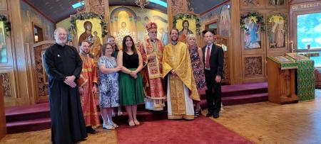 Fr Aaron Rutz and Matushka Tatiana with clergy and family following ordination
